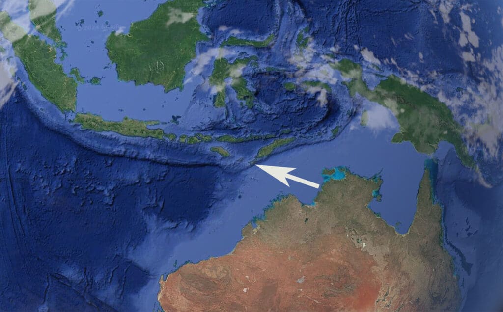 Satelite image from google earth with a white arrow pointing the location of Rote Island.